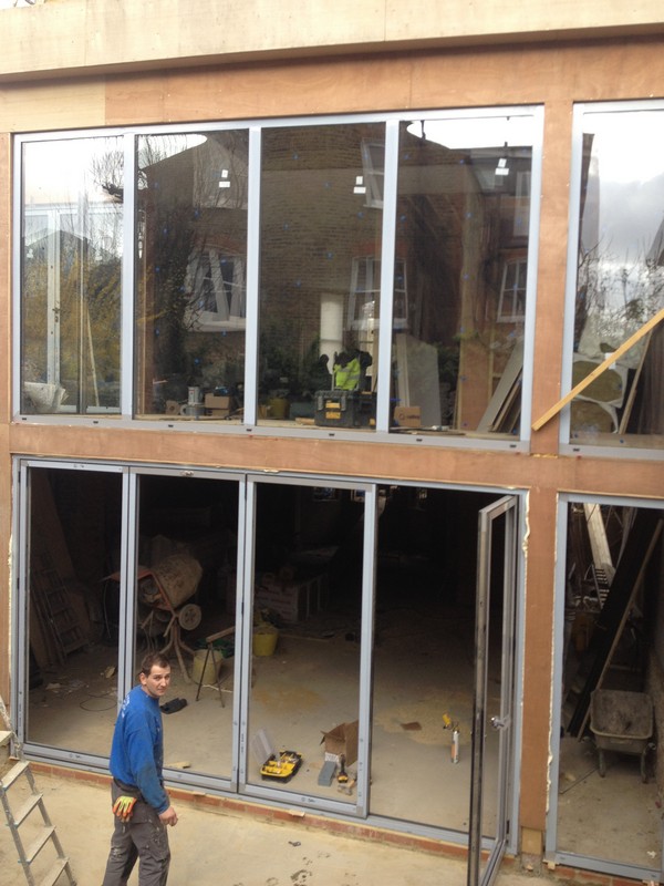 Aluminium bi-fold doors with two-storey glazing in Cricklewood