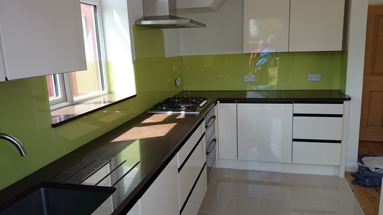 Lime green glass kitchen splashback installed by Cricklewood glaziers