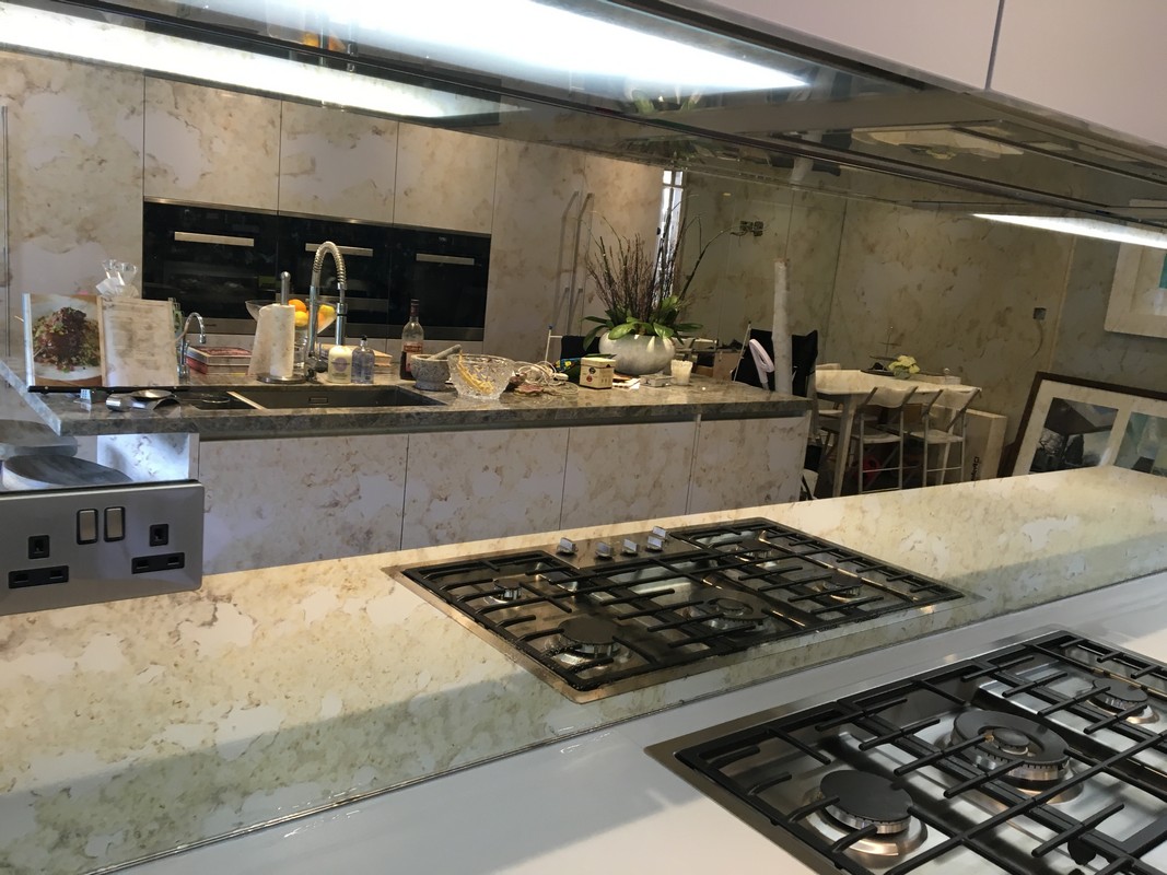 Mirror glass splashback in Cricklewood luxury kitchen